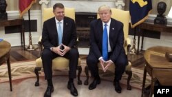 Romania’s President Klaus Iohannis (left) met with U.S. President Donald Trump the White House in Washington, D.C., on June 9.