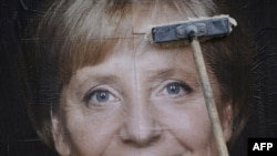 Afiș cu Angela Merkel