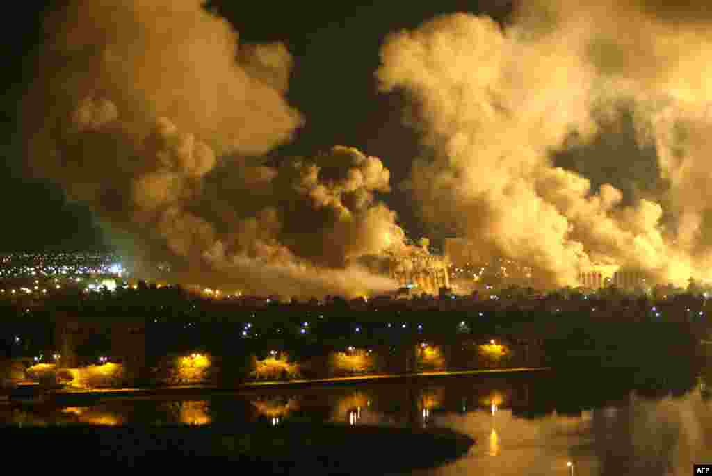 Smoke covers the presidential palace compound in Baghdad on March 21 during massive U.S.-led air raids.