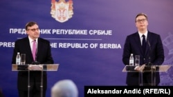 U.S. Deputy Assistant Secretary of State Matthew Palmer (left) and Serbian President Aleksandar Vucic address a press conference in Belgrade on June 10.