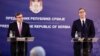 U.S. Deputy Assistant Secretary of State Matthew Palmer (left) and Serbian President Aleksandar Vucic address a press conference in Belgrade on June 10.