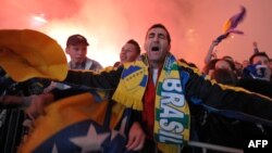 Supporters of the Bosnian national football team celebrate World Cup qualification. 