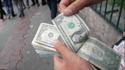 'Qara bazar' alverçisi: 'Bizə hər 100 dollardan ya bir manat qalır, ya da qalmır...'