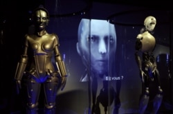 The Maschinenmensch (Machine-Person) from the film Metropolis by Fritz Lang (left) was displayed in an exhibition in Paris in 2012.