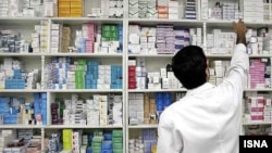 Iran -- An employee of pharmacy collects medicine in a pharmacy in Iran, undated