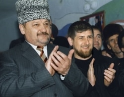 Akhmad Kadyrov (left) with his son Ramzan in March 2004