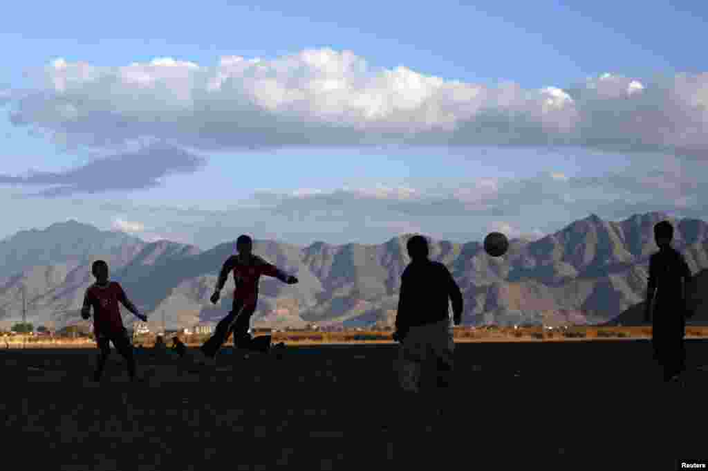 Afghan boys play soccer in Kabul, Afghanistan, on November 25. 