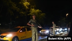 A Turkish security officer on the side of the road in Istanbul.