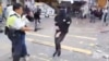 Гонконг: поліцейський вистрелив у протестувальника