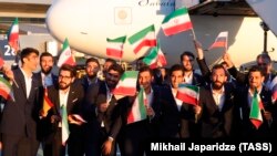 Members of the Iranian national soccer team arrive at Moscow's Vnukovo airport on June 5.