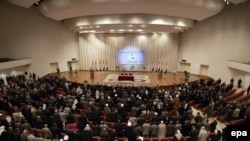 Iraq -- Members of the new parliament are sworn in during the first session of the Iraqi National Assembly in Baghdad three months after parliamentary elections, 16 Mar. 2006