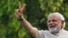 India -- Hindu nationalist Narendra Modi, the prime ministerial candidate for India's main opposition Bharatiya Janata Party (BJP), gestures during a public meeting in Vadodra, in the western Indian state of Gujarat May 16, 2014 