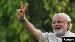 Narendra Modi, the prime ministerial candidate for India's main opposition Bharatiya Janata Party (BJP), gestures during a public meeting in Vadodra, in the western Indian state of Gujarat, on May 16.