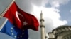 Turkish and EU flags fly in Istanbul. Garton Ash says the EU must fulfill its long-standing promises to Turkey -- and other countries that meet its criteria.