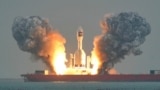A Chinese Gravity-1 rocket lifts off on October 11 carrying three satellites into orbit