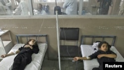 Schoolgirls receive treatment in a Kabul hospital 