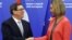 The EU's foreign policy chief, Federica Mogherini (right) welcomes Cuban Foreign Minister Bruno Rodriguez Parrilla at the start of an EU-Cuba political dialogue in Brussels on December 12.