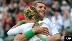 U.K. -- Belarus' Victoria Azarenka (L) and Max Mirnyi celebrate after winning the gold medal of mixed doubles gold medal match of the London 2012 Olympic Games, London, 05Aug2012