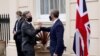 British Foreign Secretary Dominic Raab (right) greets U.S. Secretary of State Antony Blinken at Carlton Gardens for talks in London on May 3.