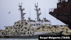 The Ukrainian naval ships seized by Russia are seen anchored at a port in Kerch on December 5.