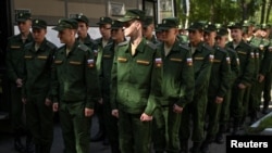 Russian conscripts attend a ceremony before their departure for garrisons in Omsk, Russia, on June 17. Russia has mandatory conscription, where all men between 18 and 27 are required to serve at least a year in the armed forces.