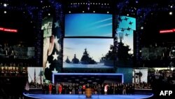 Retired U.S. Navy Admiral John B. Nathman speaks in front of a giant backdrop of what turns out are Russian Navy warships at the Democratic National Convention on September 6.