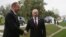 Russia -- Russian President Vladimir Putin (R) greets his Azerbaijani counterpart Ilham Aliyev ahead of the Caspian Sea summit in Astrakhan, September 29, 2014