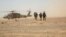 Afghan troops disembark an Afghan Air Force Black Hawk helicopter at Camp Shorabak in Helmand Province. The air force, SIGAR's report noted, is now increasingly overstretched.