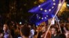 Armenia - Paruyr Hayrikian (L) and his supporters carry European Union flags on Marshal Bagramian Avenue, Yerevan, 2Jul2015.