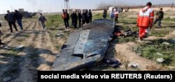 Debris from the Ukraine International Airlines jet is seen on the ground on the outskirts of Tehran on January 8, 2020.