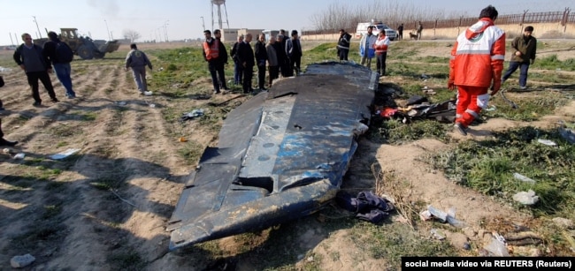 Debris from the Ukraine International Airlines jet is seen on the ground on the outskirts of Tehran on January 8, 2020.