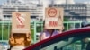 Demonstrators hold signs as they march across the Francis Scott Key Bridge during a rally in support of the Iranian people and to condemn the execution of political prisoners in Iran, in Washington, DC, on May 16, 2026.