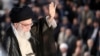 Supreme Leader Ayatollah Ali Khamenei greets the crowd on June 4, 2018, during a ceremony in Tehran on the occasion of the 29th anniversary of the death of the founder of the Islamic republic.