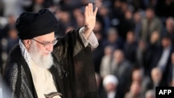 Supreme Leader Ayatollah Ali Khamenei greets the crowd on June 4, 2018, during a ceremony in Tehran on the occasion of the 29th anniversary of the death of the founder of the Islamic republic.