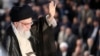 (FILES) A handout picture provided by the office of Iran's Supreme Leader Ayatollah Ali Khamenei on June 4, 2018, shows him greeting the crowd during a ceremony on the occasion of the 29th anniversary of the death of the founder of the Islamic Republic in