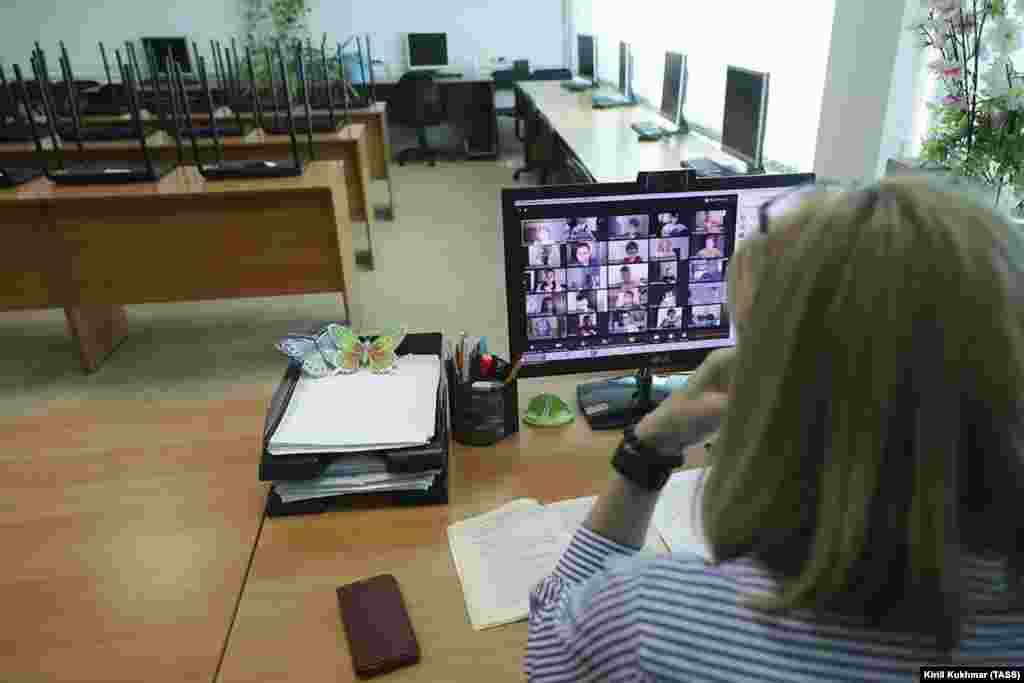 A teacher communicates with her class on a video-conferencing app in Novosibirsk, Russia.&nbsp; 