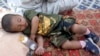 Thousands have fled their homes, like this boy at a Baghdad camp for displaced families (file photo)