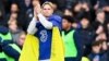 Mykhailo Mudryk applauded fans at halftime while wearing a Ukrainian flag during Chelsea's match against Crystal Palace on January 15. 