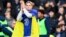 Mykhailo Mudryk applauded fans at halftime while wearing a Ukrainian flag during Chelsea's match against Crystal Palace on January 15. 