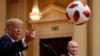FINLAND -- U.S. President Donald Trump throws a football to U.S. First Lady Melania Trump during a joint news conference with Russia's President Vladimir Putin after their meeting in Helsinki, Finland, July 16, 2018. 