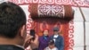Семья фотографируется на фоне юрты во время празднования Наурыза. Алматы, 22 марта 2009 года.
