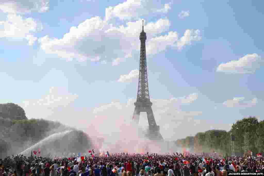 France supporters cheer in the fan zone as they watch the Russia 2018 World Cup final soccer match between France and Croatia on the Champ de Mars, Paris, on July 15. (AFP/Jacques Demarthon)