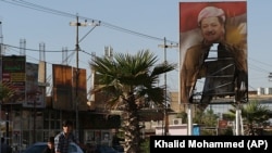 Plakat sa likom predsjednika kurdskog autonomnog regiona u Iraku Massouda Barzanija, Kirkuk