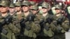 Kosovo: Women members of Kosovo Security Forces participate in parade for the 10th anniversary of independence.