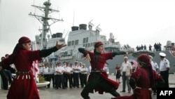 Georgian artists welcome the "USS Stout" in Georgia's Black Sea port of Batumi.