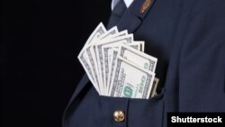 American dollars in a pocket of Russian Police officer, bribe and corruption concept