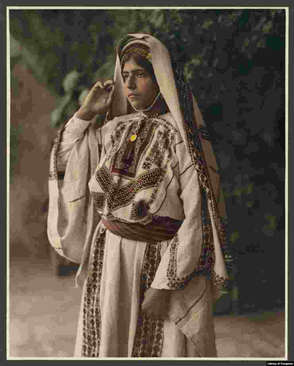 A woman in embroidered costume in Ramallah, now the headquarters of the Palestinian Authority