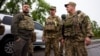 Ukrainian President Volodymyr Zelenskiy (left) visits soldiers at the front line in the Kharkiv region.