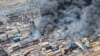 Smoke rises after a massive explosion and fire rocked a port near the southern port city of Bandar Abbas, Iran, on April 26.