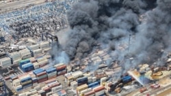Smoke rises after a massive explosion and fire rocked a port near the southern port city of Bandar Abbas, Iran, on April 26.